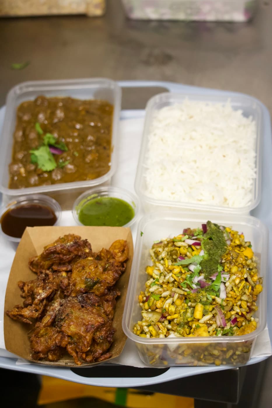 Mini India by Chatori thali — fritters, dal, bhel and rice